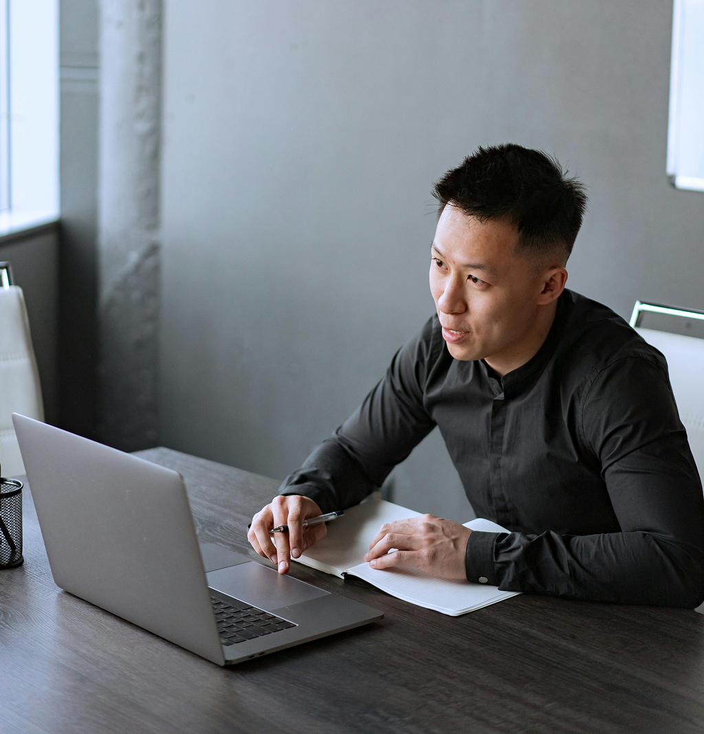 Offshore professional working diligently at a computer workstation